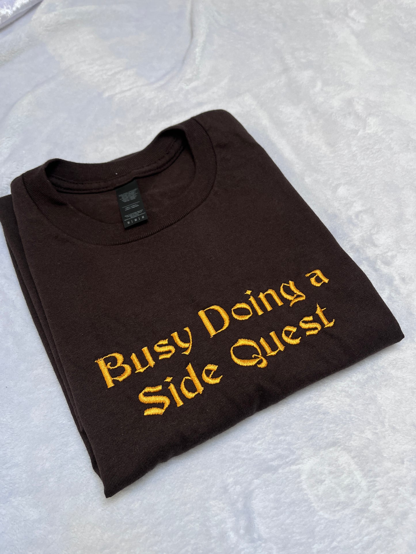 MEDIUM busy doing a side quest tee