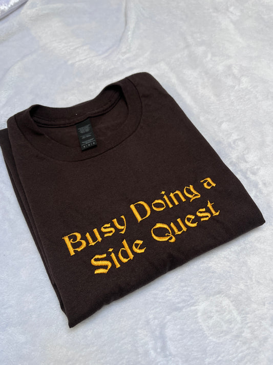 MEDIUM busy doing a side quest tee