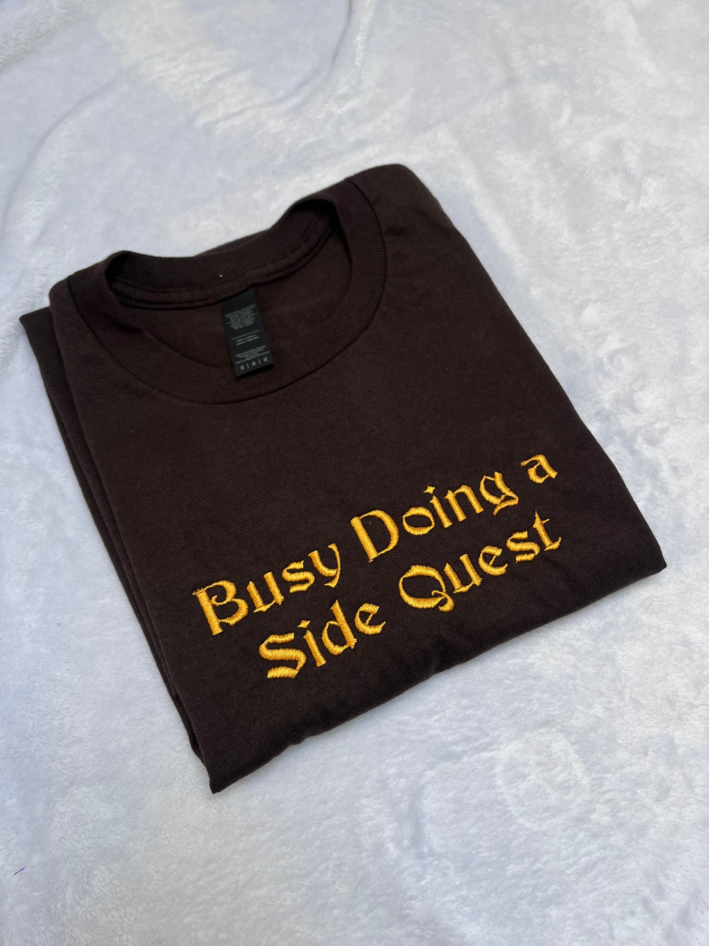 MEDIUM busy doing a side quest tee