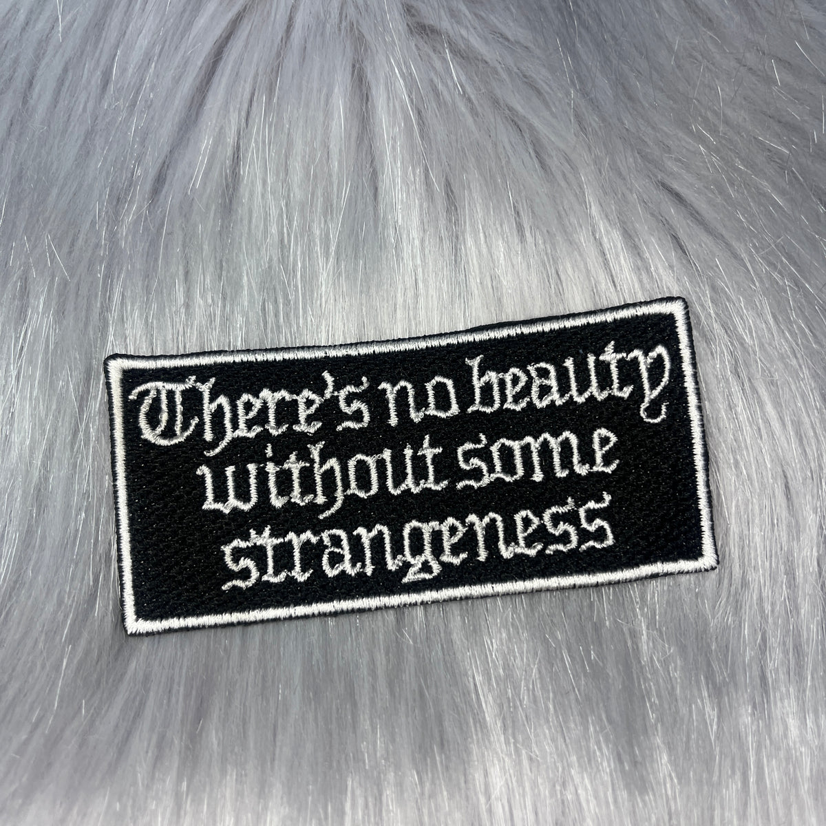 There's No Beauty Without Some Strangeness Embroidered Patch